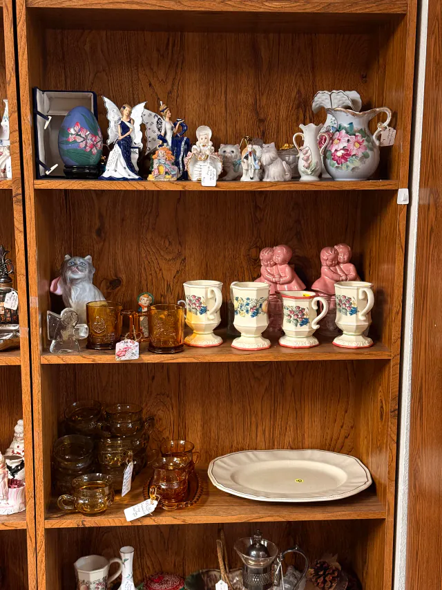 Ceramics and amber glass displayed inside Unique Treasures.
