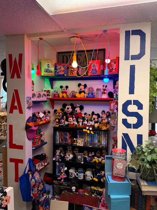 Vintage Disney toys and character collectibles displayed inside Unique Treasures.